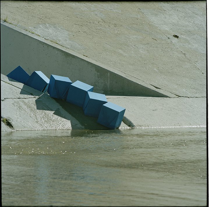 Long shadows cast by marker line on the concrete channel bank, Frogtown